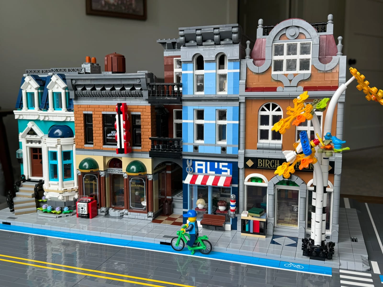 LEGO Bookshop and Detective's Office modular buildings with brick-built roads alongside