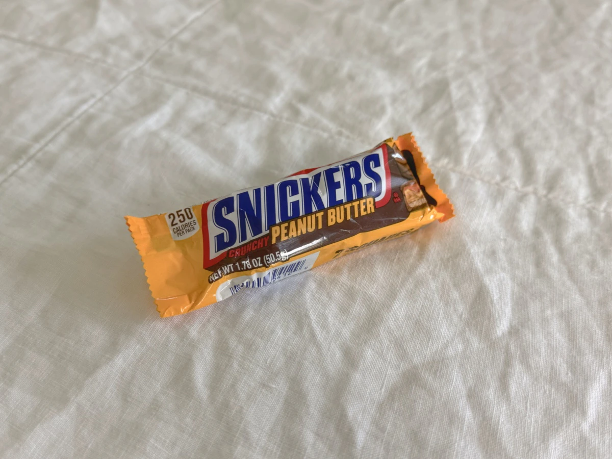 A school-bus-yellow package of 2 peanut butter Snickers